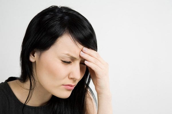 stressed woman holding head